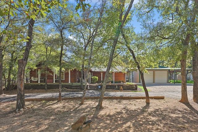 view of front facade featuring a garage and a carport