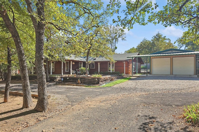 view of front of house featuring a carport and a garage