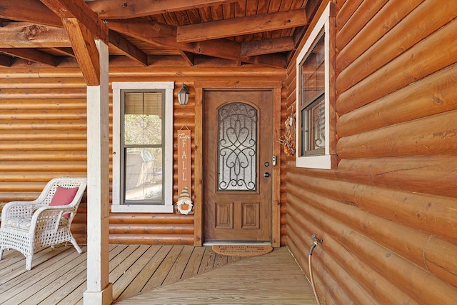 property entrance featuring a porch