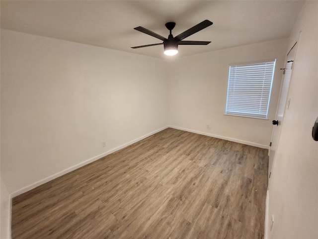 empty room with light hardwood / wood-style floors and ceiling fan