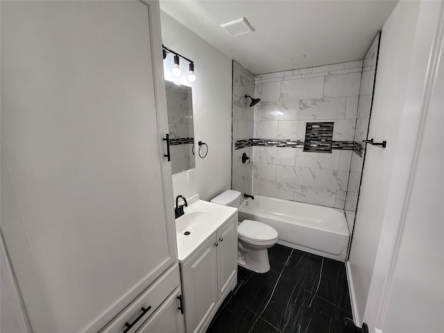 full bathroom featuring vanity, toilet, and tiled shower / bath