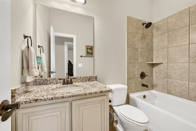 full bathroom featuring vanity, toilet, and tiled shower / bath combo