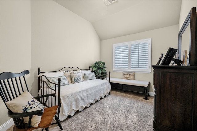 carpeted bedroom featuring vaulted ceiling