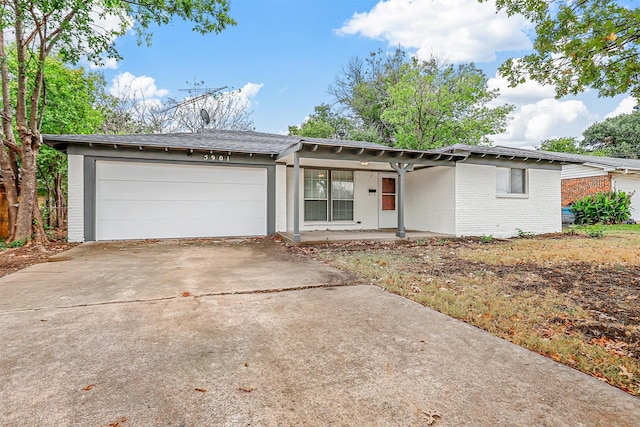 ranch-style house featuring a garage