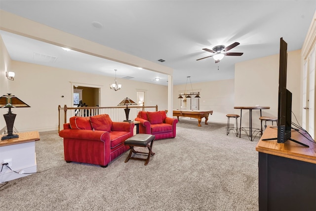 carpeted living room with ceiling fan with notable chandelier