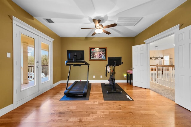 workout area featuring ceiling fan, french doors, and wood-type flooring