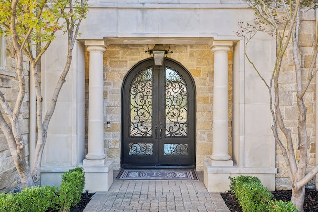 6800 Rainwood Dr, Plano, TX 75024 - doorway to property with french doors and stone siding