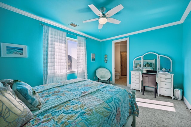 bedroom with crown molding, ceiling fan, and carpet floors