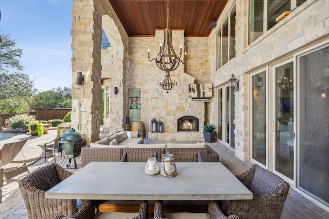 view of patio featuring an outdoor living space with a fireplace