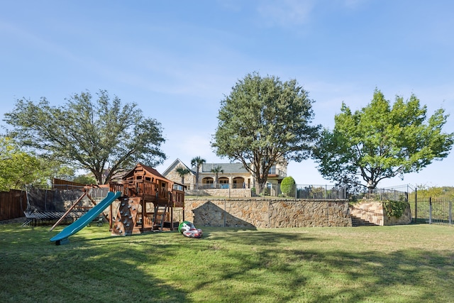 6800 Rainwood Dr, Plano, TX 75024 - view of yard featuring a trampoline and a playground