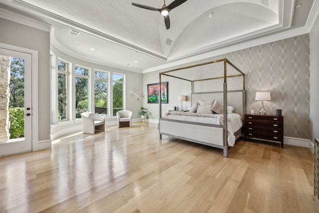 bedroom with light hardwood / wood-style floors, ceiling fan, multiple windows, and access to outside