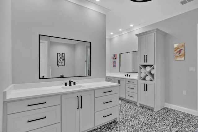 bathroom featuring tile patterned flooring and vanity