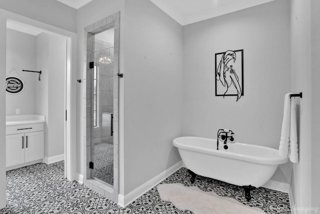 bathroom with tile patterned flooring, vanity, and separate shower and tub