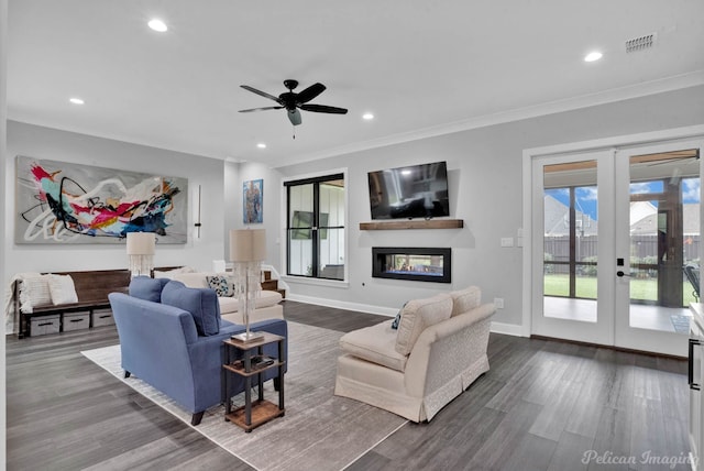 living room featuring ornamental molding, wood-type flooring, and french doors