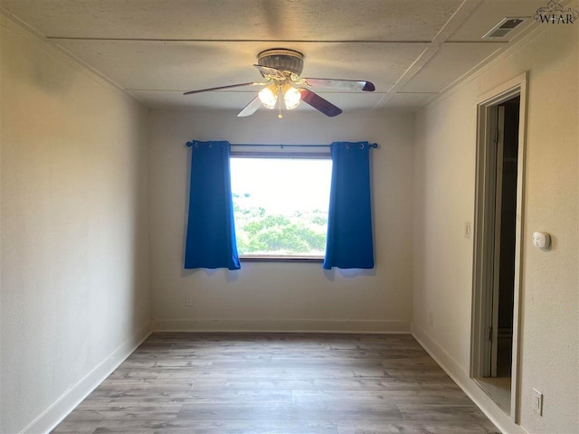 unfurnished room featuring hardwood / wood-style flooring and ceiling fan