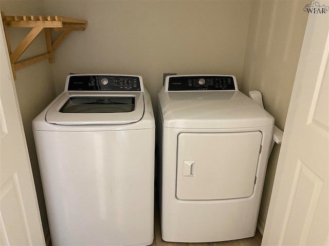 laundry room featuring washer and clothes dryer