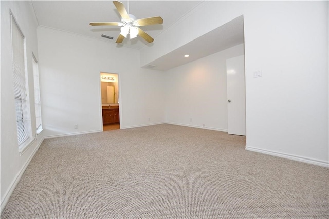 carpeted spare room with ornamental molding and ceiling fan