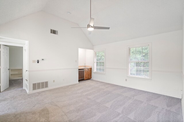 interior space with high vaulted ceiling, ceiling fan, and sink