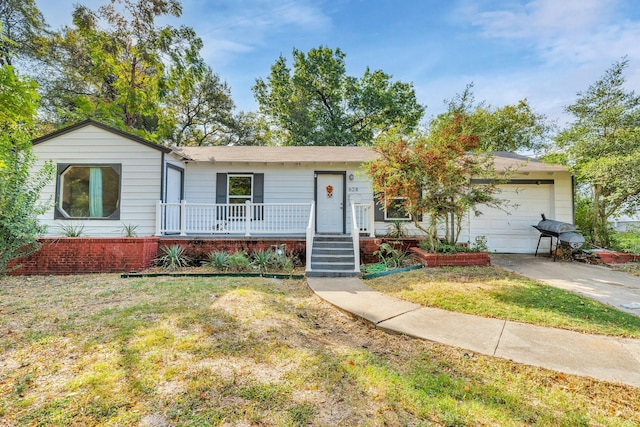 628 Annarose Dr, Dallas, TX 75232 - single story home with covered porch, a garage, a front yard, driveway, and brick siding