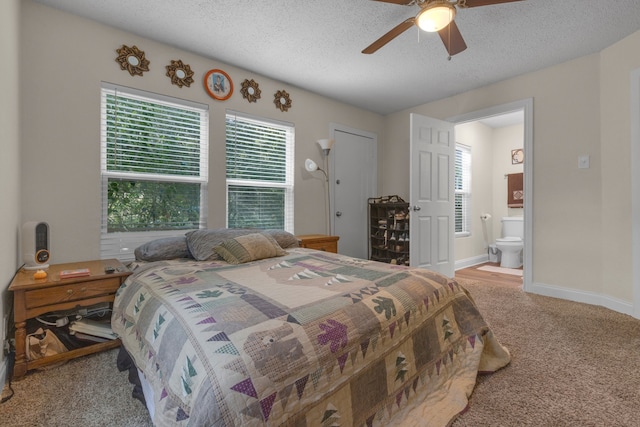 carpeted bedroom featuring a textured ceiling, ceiling fan, and ensuite bathroom