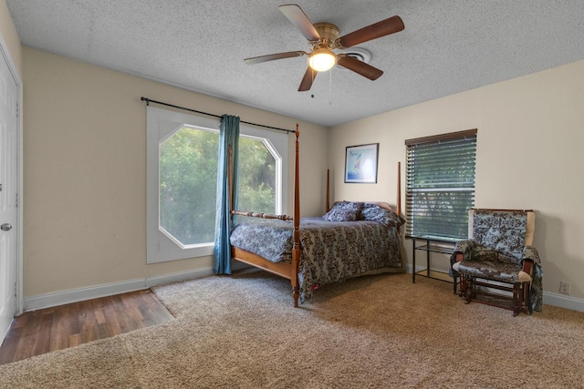 628 Annarose Dr, Dallas, TX 75232 - bedroom featuring a textured ceiling, baseboards, carpet flooring, and a ceiling fan
