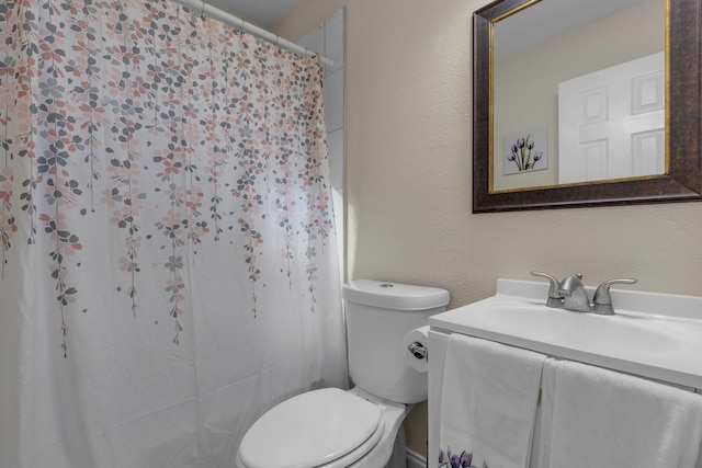 628 Annarose Dr, Dallas, TX 75232 - bathroom with toilet, a textured wall, vanity, and curtained shower