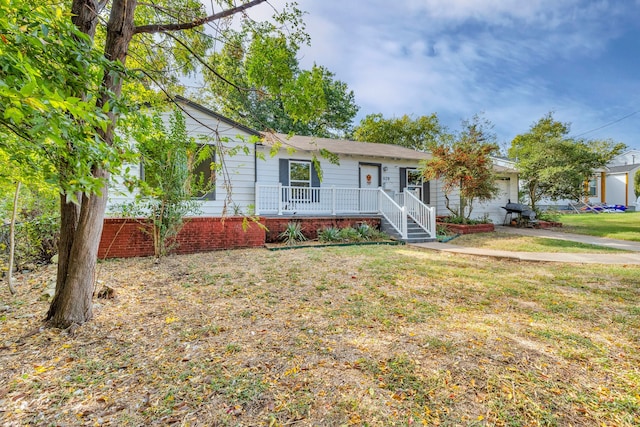 ranch-style house with a front lawn