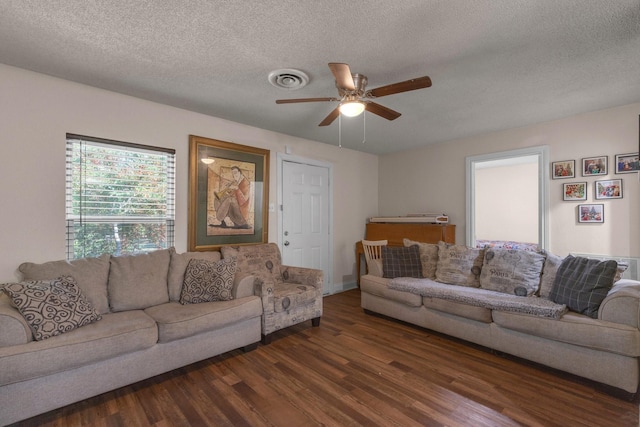 628 Annarose Dr, Dallas, TX 75232 - living area with wood finished floors, ceiling fan, and a textured ceiling