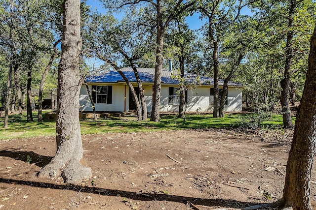 ranch-style house with a front lawn