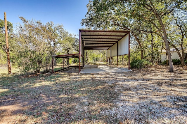 exterior space with a carport