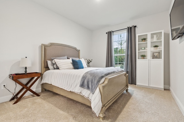 bedroom with light carpet