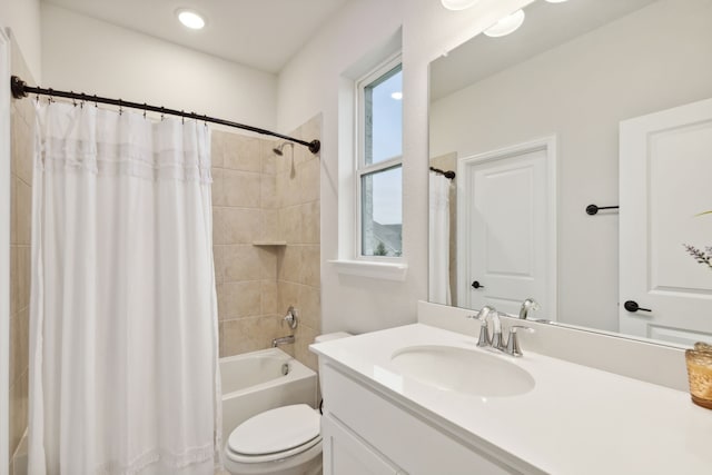 full bathroom featuring vanity, toilet, plenty of natural light, and shower / bath combo with shower curtain