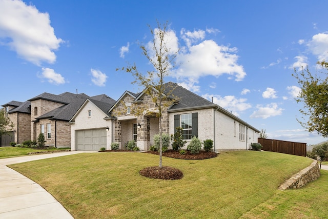 view of front facade with a garage and a front yard