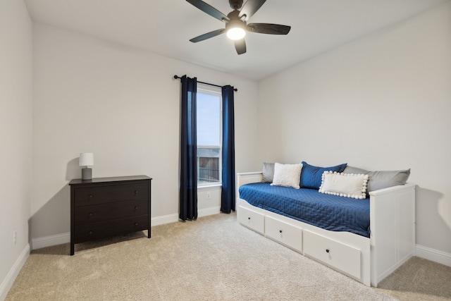 bedroom with ceiling fan and light colored carpet