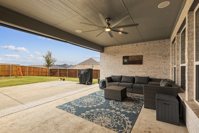 view of patio with outdoor lounge area, ceiling fan, and a grill