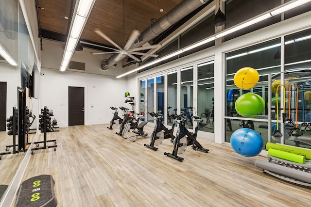 gym with hardwood / wood-style floors