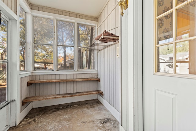 unfurnished sunroom with plenty of natural light