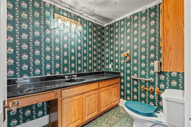 bathroom featuring vanity, tile patterned floors, a textured ceiling, and toilet