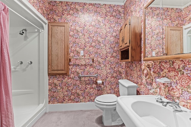 bathroom featuring walk in shower, toilet, sink, and crown molding