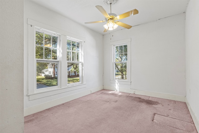 empty room with light carpet and ceiling fan