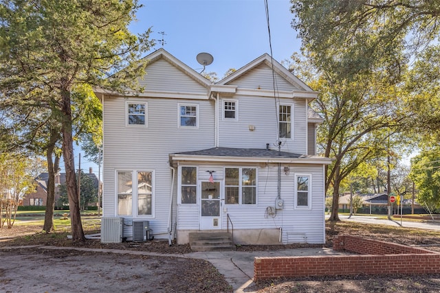 back of property with central AC unit