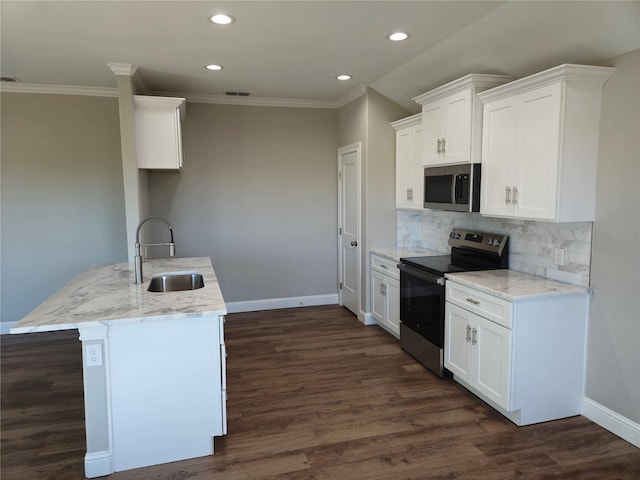 kitchen with appliances with stainless steel finishes, sink, backsplash, white cabinets, and light stone counters