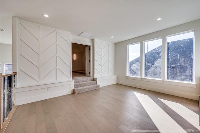 unfurnished living room with light hardwood / wood-style floors