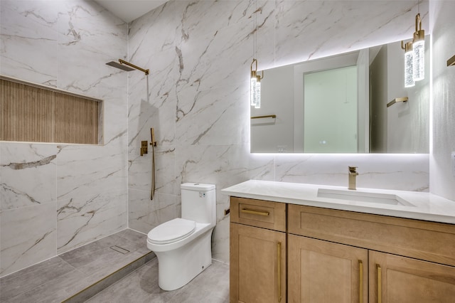 bathroom featuring vanity, toilet, tiled shower, and tile walls