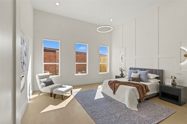 bedroom featuring a high ceiling