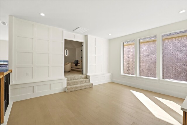 unfurnished living room with light hardwood / wood-style floors