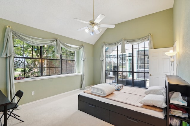 carpeted bedroom featuring ceiling fan and lofted ceiling