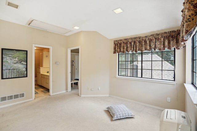 carpeted bedroom with ensuite bathroom