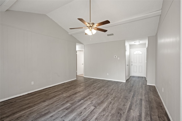 unfurnished living room with dark hardwood / wood-style flooring, vaulted ceiling, and ceiling fan