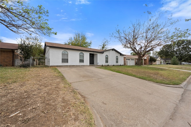 ranch-style house featuring a front lawn